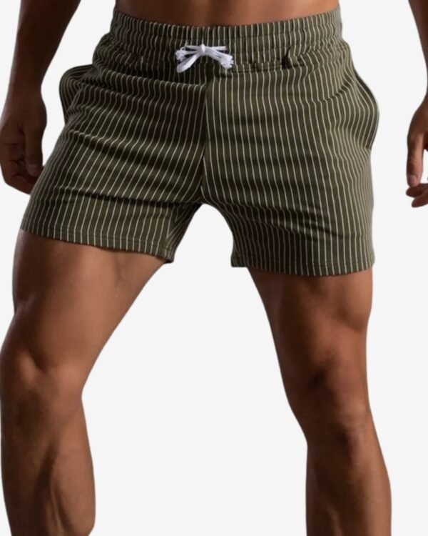 model wearing wholesale olive green striped shorts
