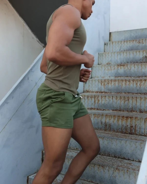 model wearing army green men's short shorts