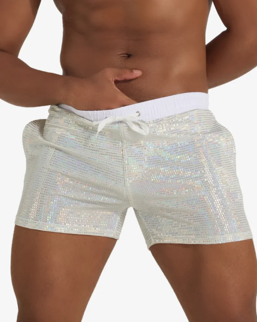 Male model wearing white sequin party shorts -new wholesale gay apparel