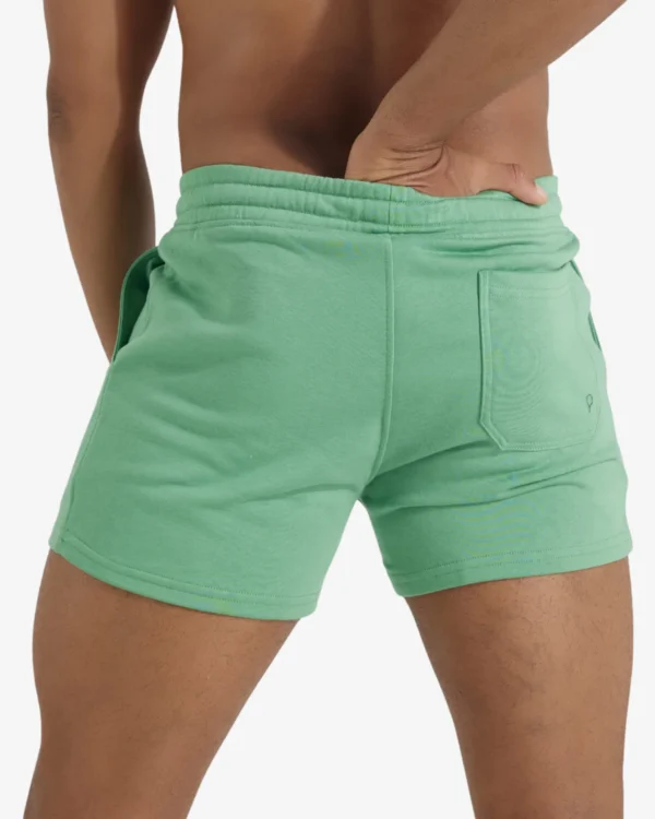 model wearing wholesale men's bold green sport shorts