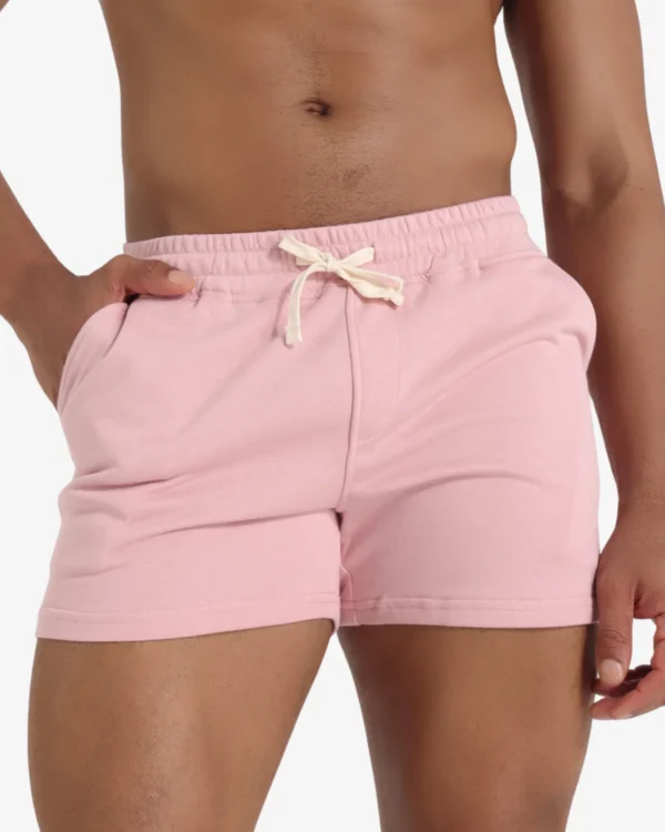 Model wearing men's pink short shorts wholesale