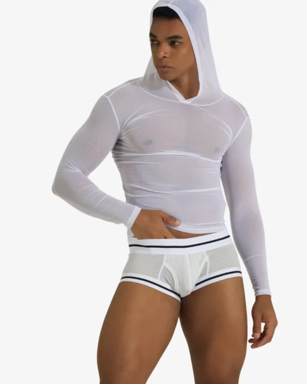 Model wearing white wholesale gay men's sheer mesh top with long sleeves — wholesale men's see-through crop top with hood by Spicy and Shiny