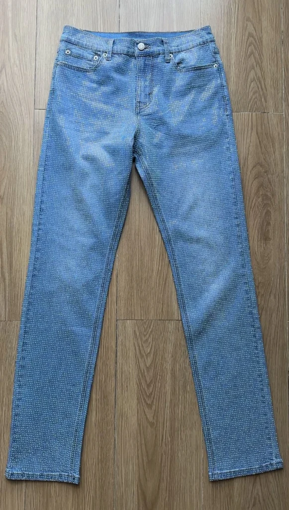flat lay of Light blue rhinestone denim pants - Men's halloween outfit ideas